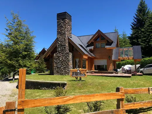 Cabin with stone chimney and picnic table