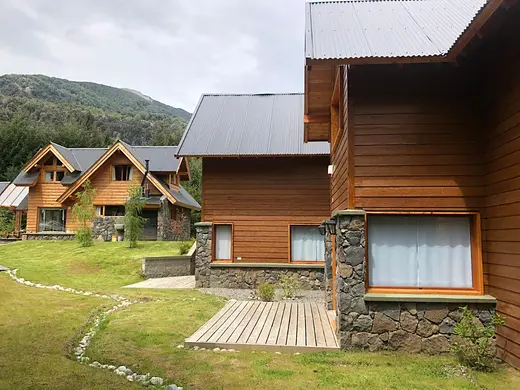 The cabins on the property with mountain views